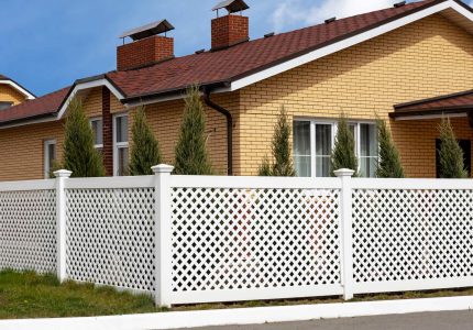 A house with white PVC fence