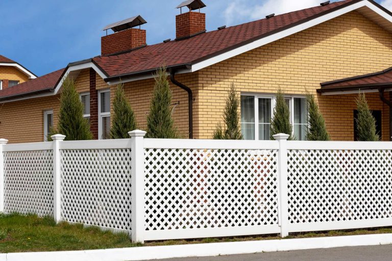 A house with white PVC fence